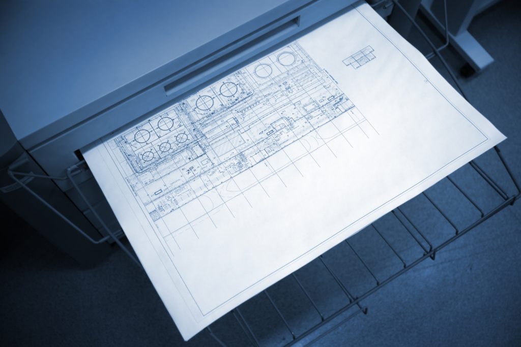 A wide format printer in action.